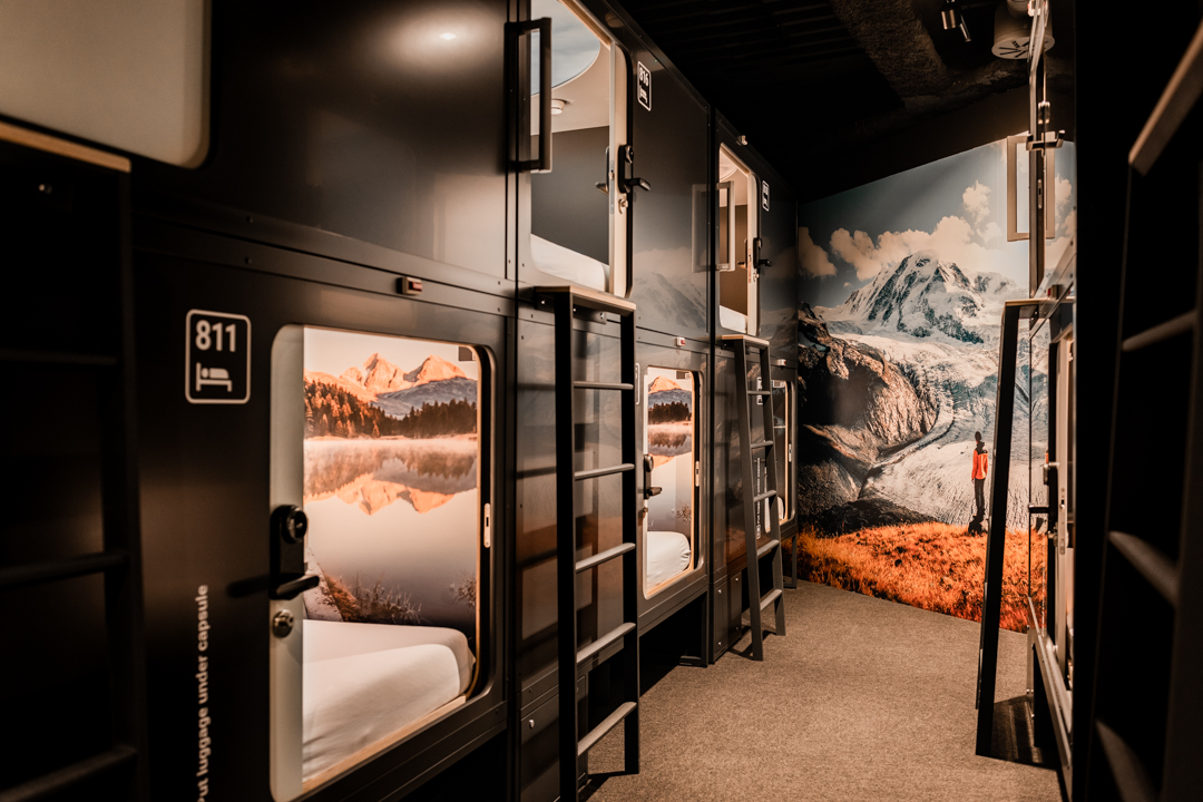 Dormitory room of capsules themed in a alpine destination